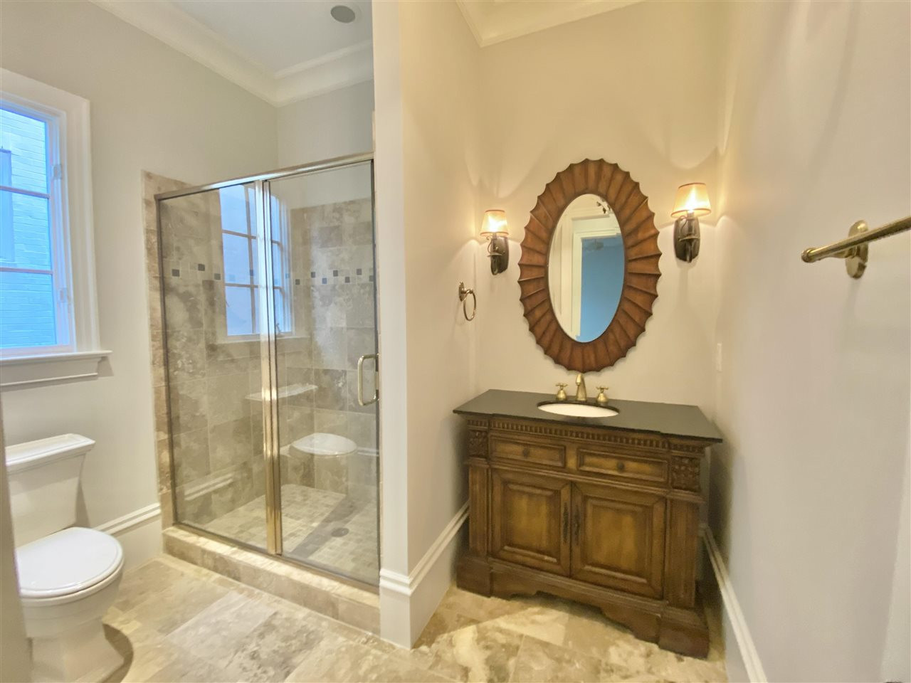 526 Wayne Drive Raleigh, NC 27608 - Photo 27 of 30 Downstairs full bathroom is across from the first floor bedroom - they are both down their own hallway away from the living areas of the home! Bathroom