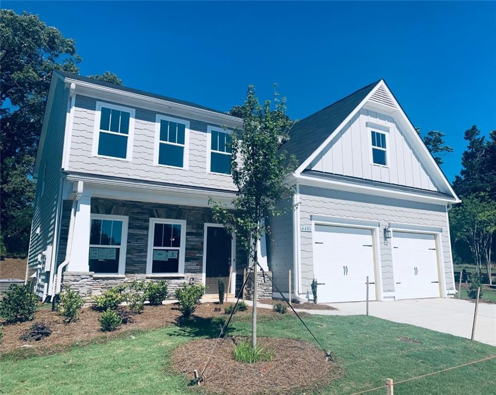 This is our popular Richmond Floorplan with a full front porch.  5 bedrooms and 4 full baths.  A bedroom on the main level is convenient for guests. 