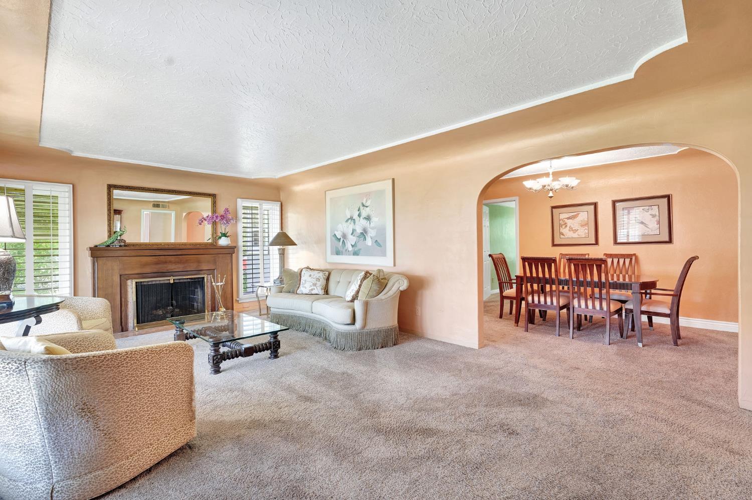 200 Lyons Street Madera, CA 93638 - Photo 11 of 32 a living room with furniture and a fireplace