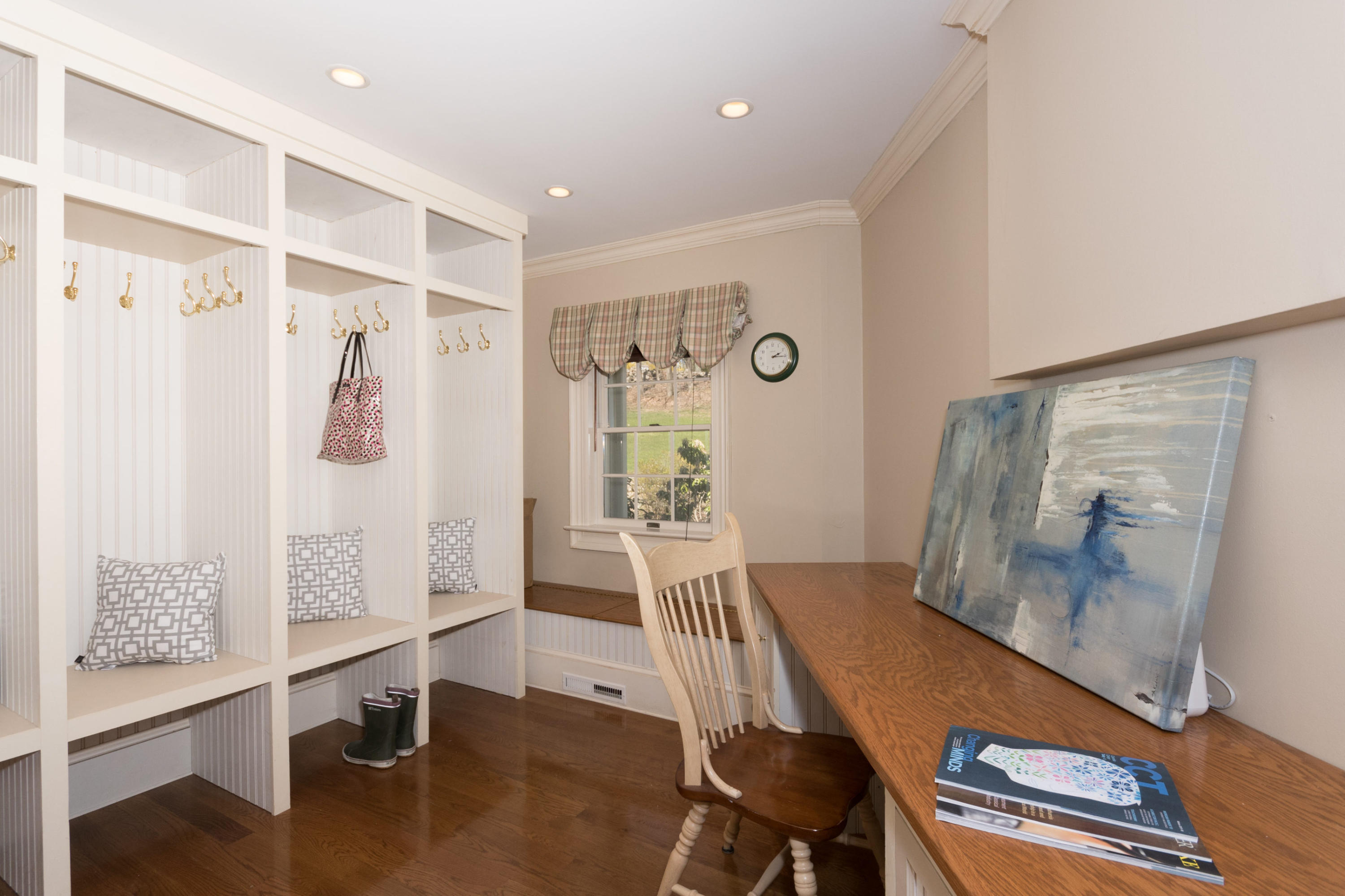 123 Lone Tree Farm Road New Canaan, CT 06840 - Photo 14 of 26 a view of a hallway with workspace and wooden floor