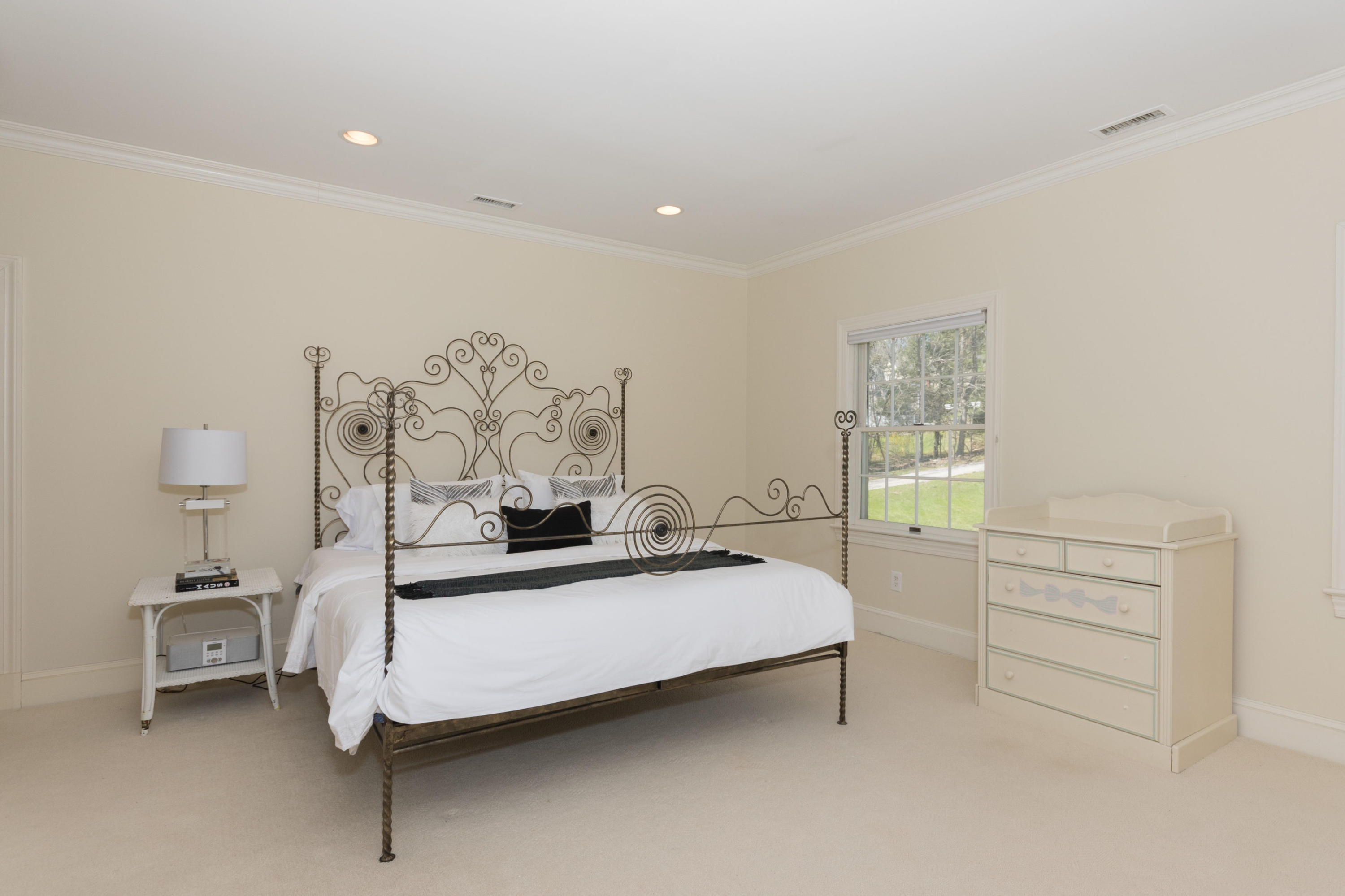 123 Lone Tree Farm Road New Canaan, CT 06840 - Photo 18 of 26 a bedroom with a bed and a table in it