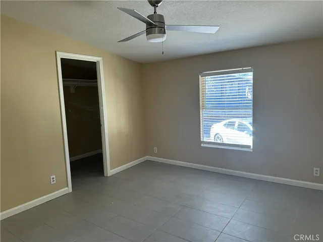 a view of a refrigerator and an empty room in a room