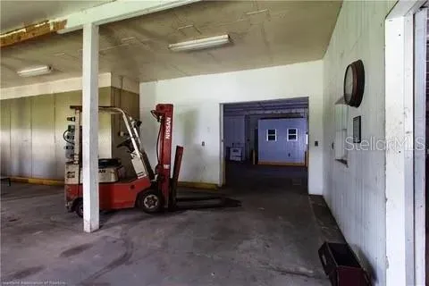 a backyard of a house with barbeque oven and a fountain