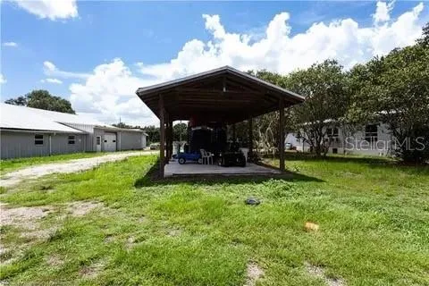 a view of a house with a back yard