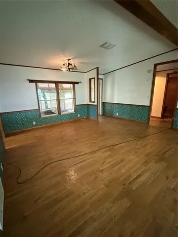 a big house with a big yard and large trees