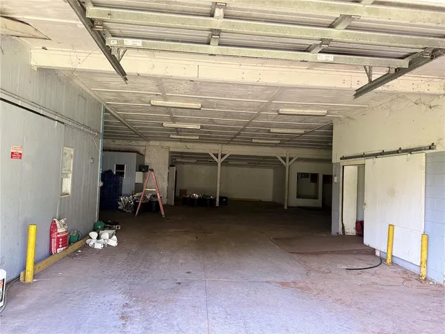 a large body of water with a building in the background