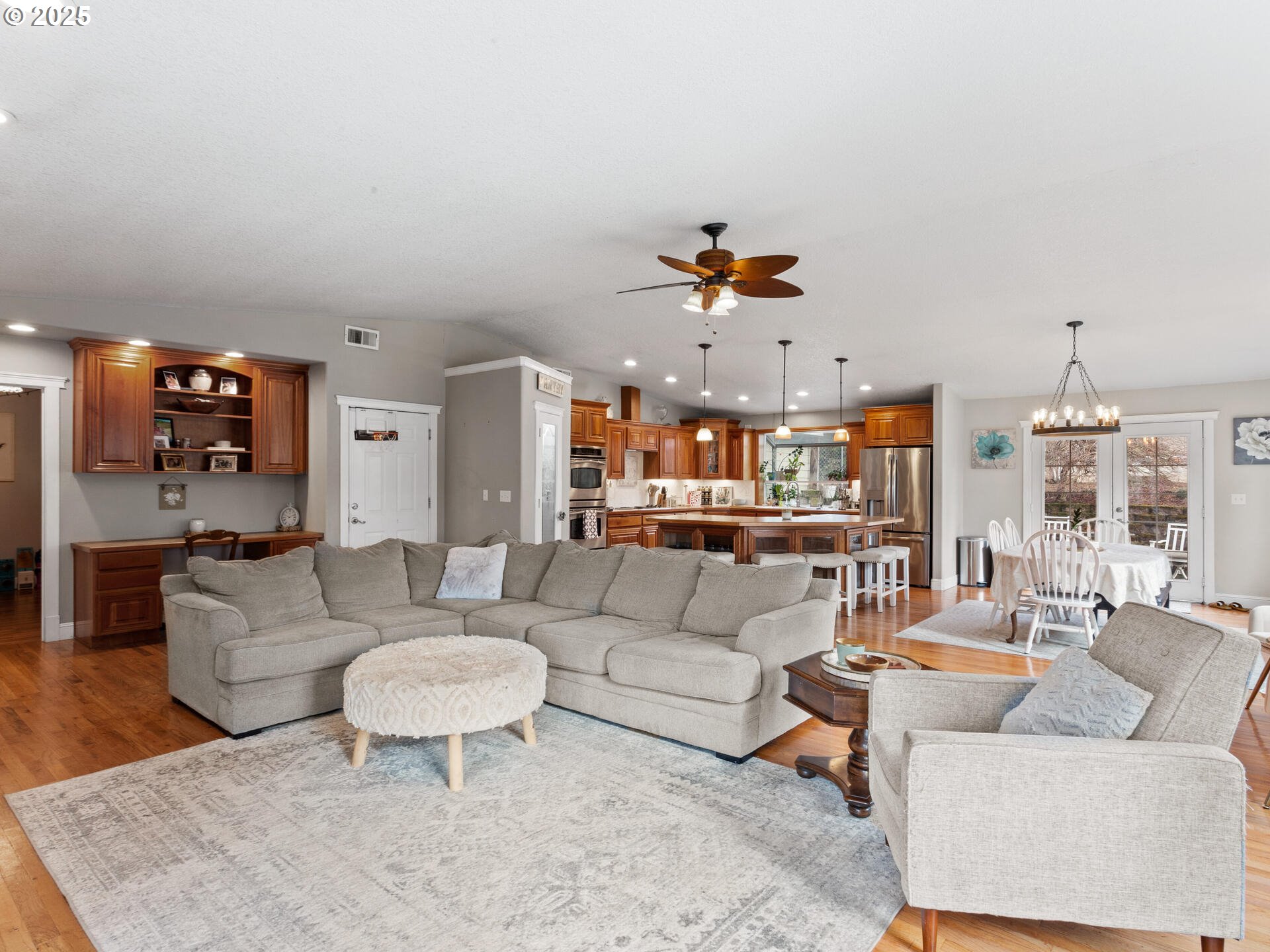 1621 Northeast 194th Street Ridgefield, WA 98642 - Photo 15 of 48 a living room with furniture and a chandelier