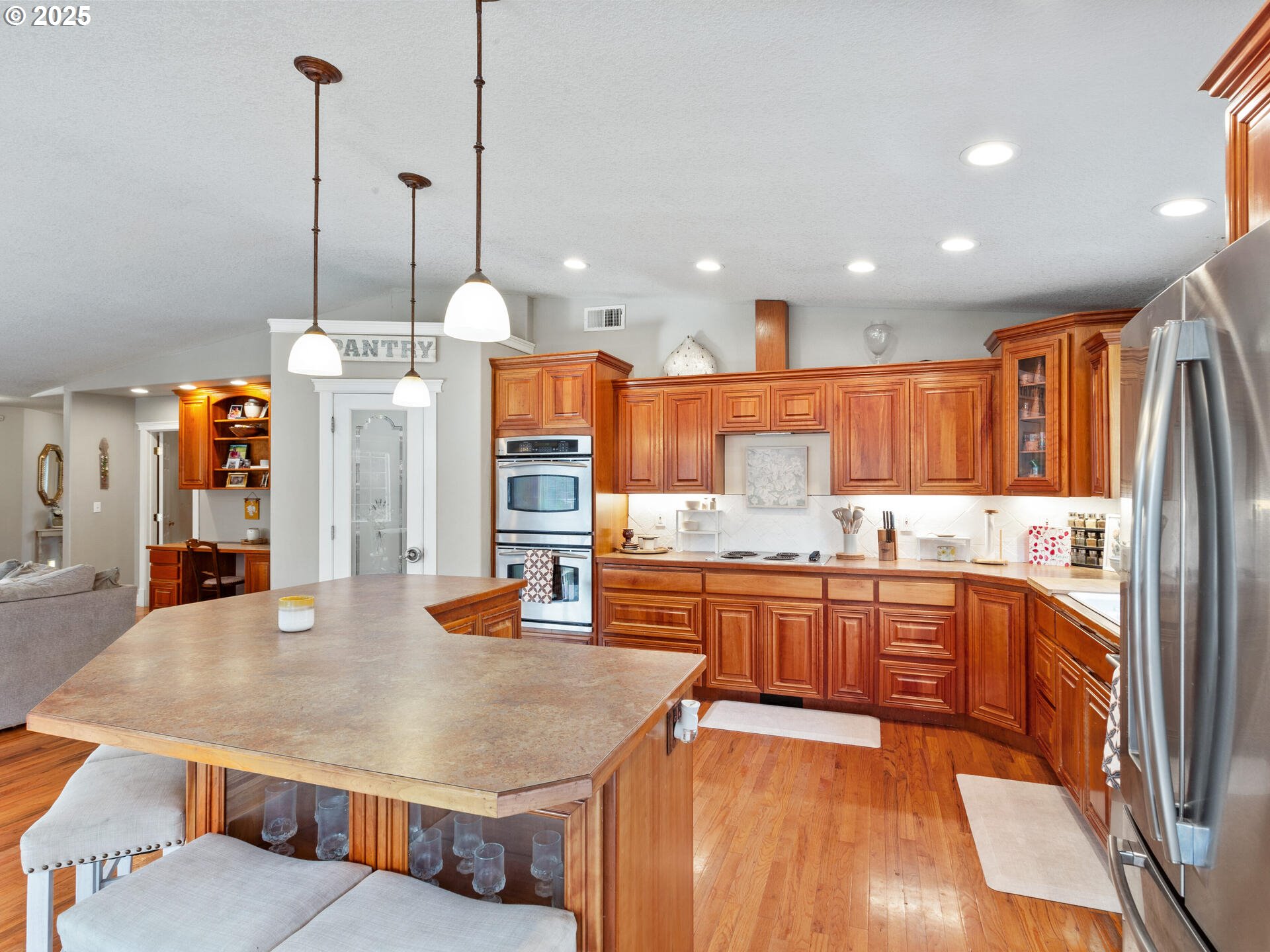 1621 Northeast 194th Street Ridgefield, WA 98642 - Photo 20 of 48 a kitchen with stainless steel appliances granite countertop a sink a stove and a refrigerator