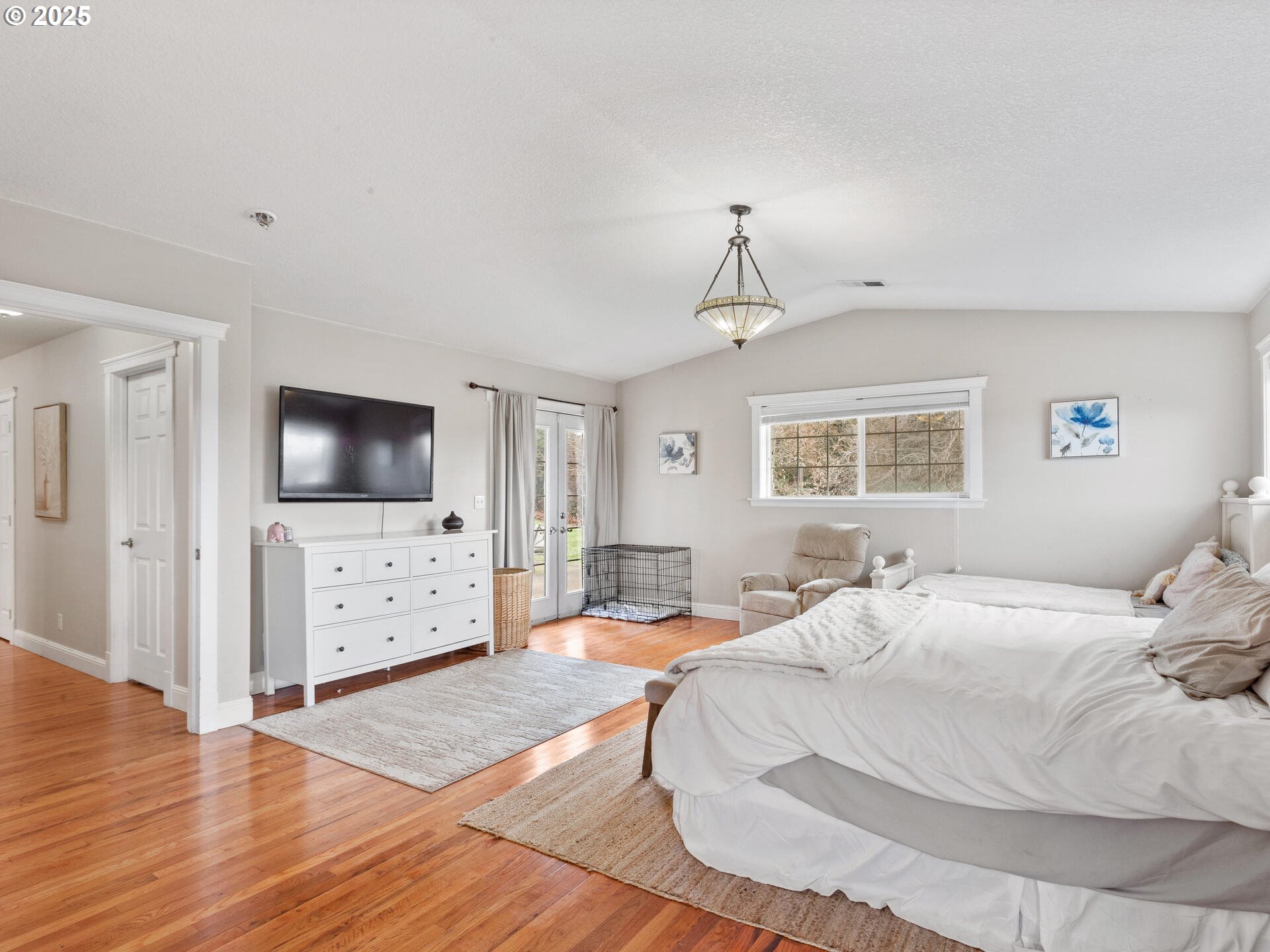 1621 Northeast 194th Street Ridgefield, WA 98642 - Photo 27 of 48 a bedroom with a bed and a flat screen tv