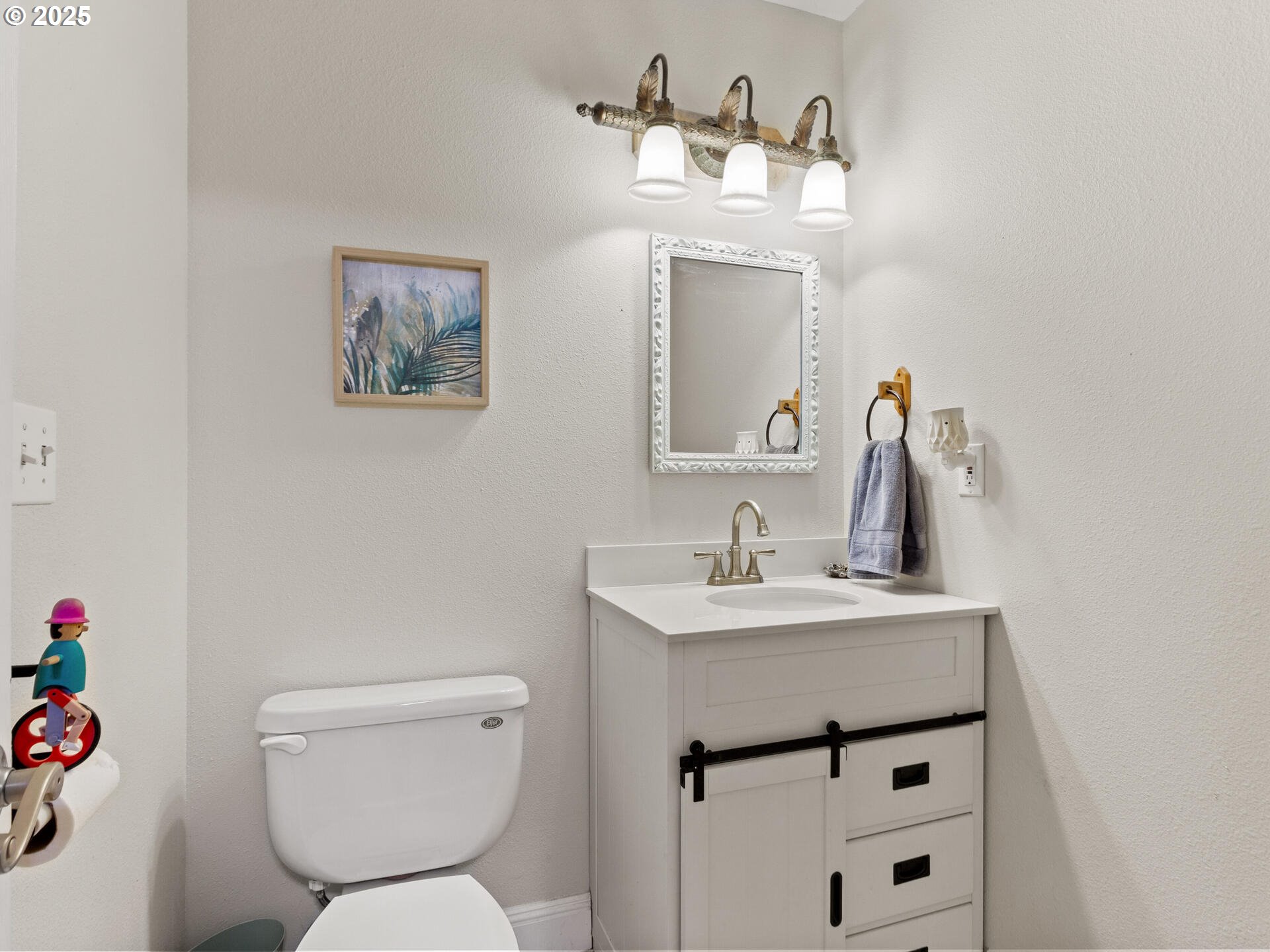 1621 Northeast 194th Street Ridgefield, WA 98642 - Photo 30 of 48 a bathroom with a toilet sink and mirror