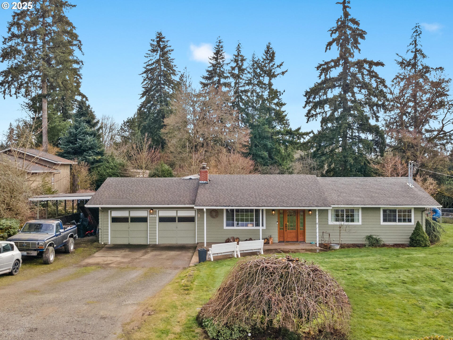 1621 Northeast 194th Street Ridgefield, WA 98642 - Photo 3 of 48 a front view of a house with a garden