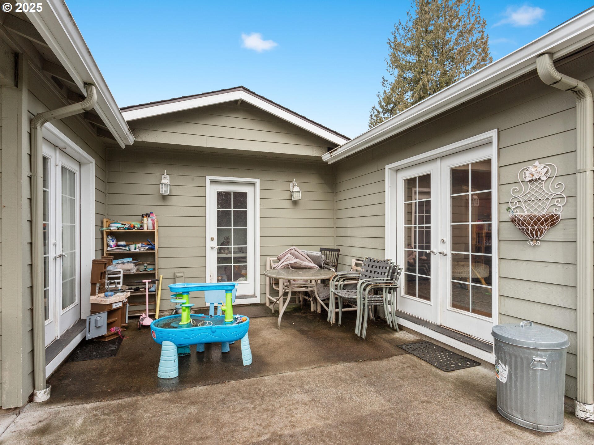 1621 Northeast 194th Street Ridgefield, WA 98642 - Photo 33 of 48 a view of a patio with couple of chairs and a potted plant