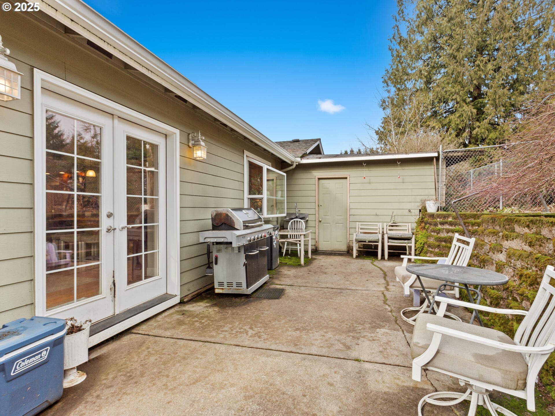 1621 Northeast 194th Street Ridgefield, WA 98642 - Photo 37 of 48 a view of a patio with table and chairs and wooden fence