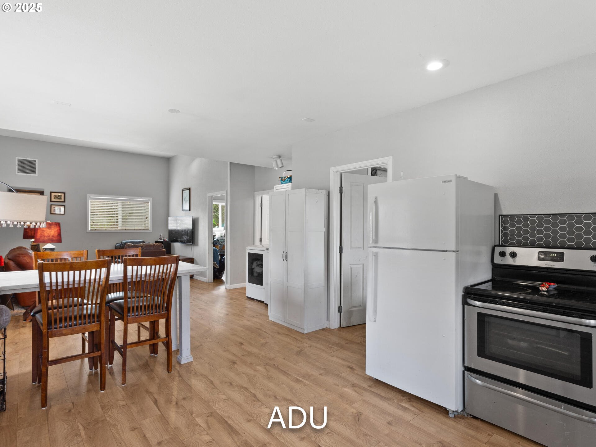 1621 Northeast 194th Street Ridgefield, WA 98642 - Photo 42 of 48 a kitchen with stainless steel appliances granite countertop a refrigerator and a stove top oven