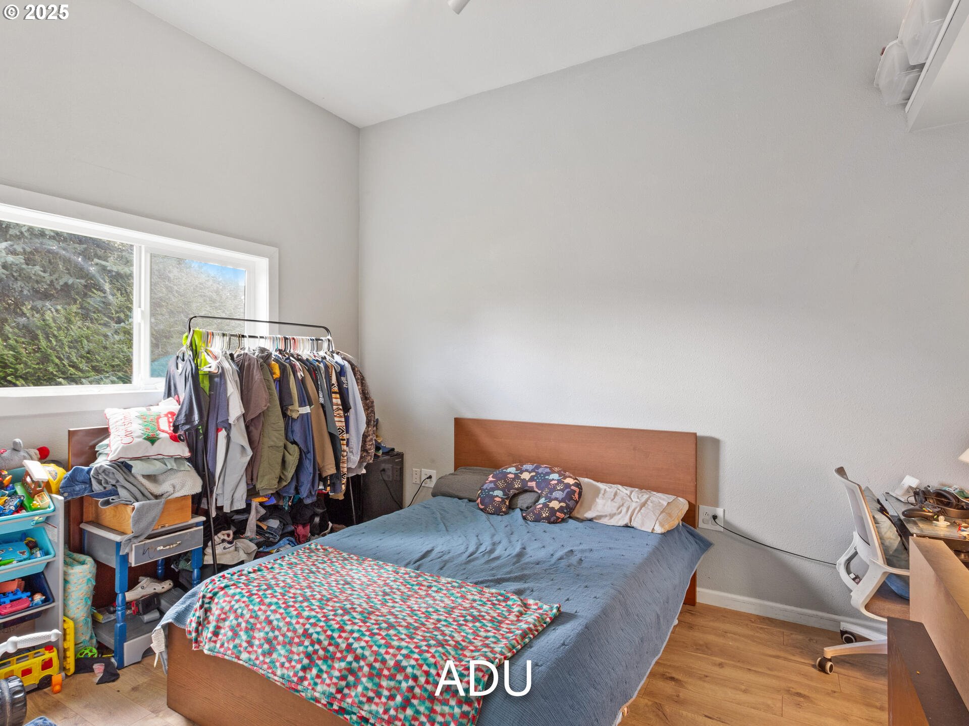 1621 Northeast 194th Street Ridgefield, WA 98642 - Photo 47 of 48 a bed sitting in a bedroom next to a window