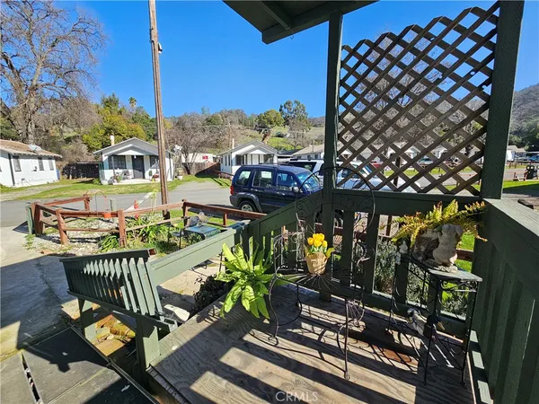 a view of a balcony with chairs