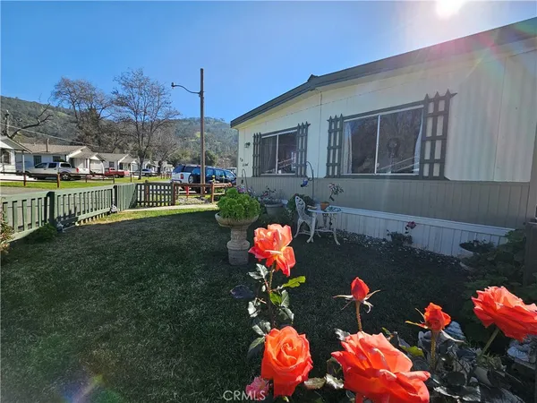 a front view of house with yard and outdoor seating