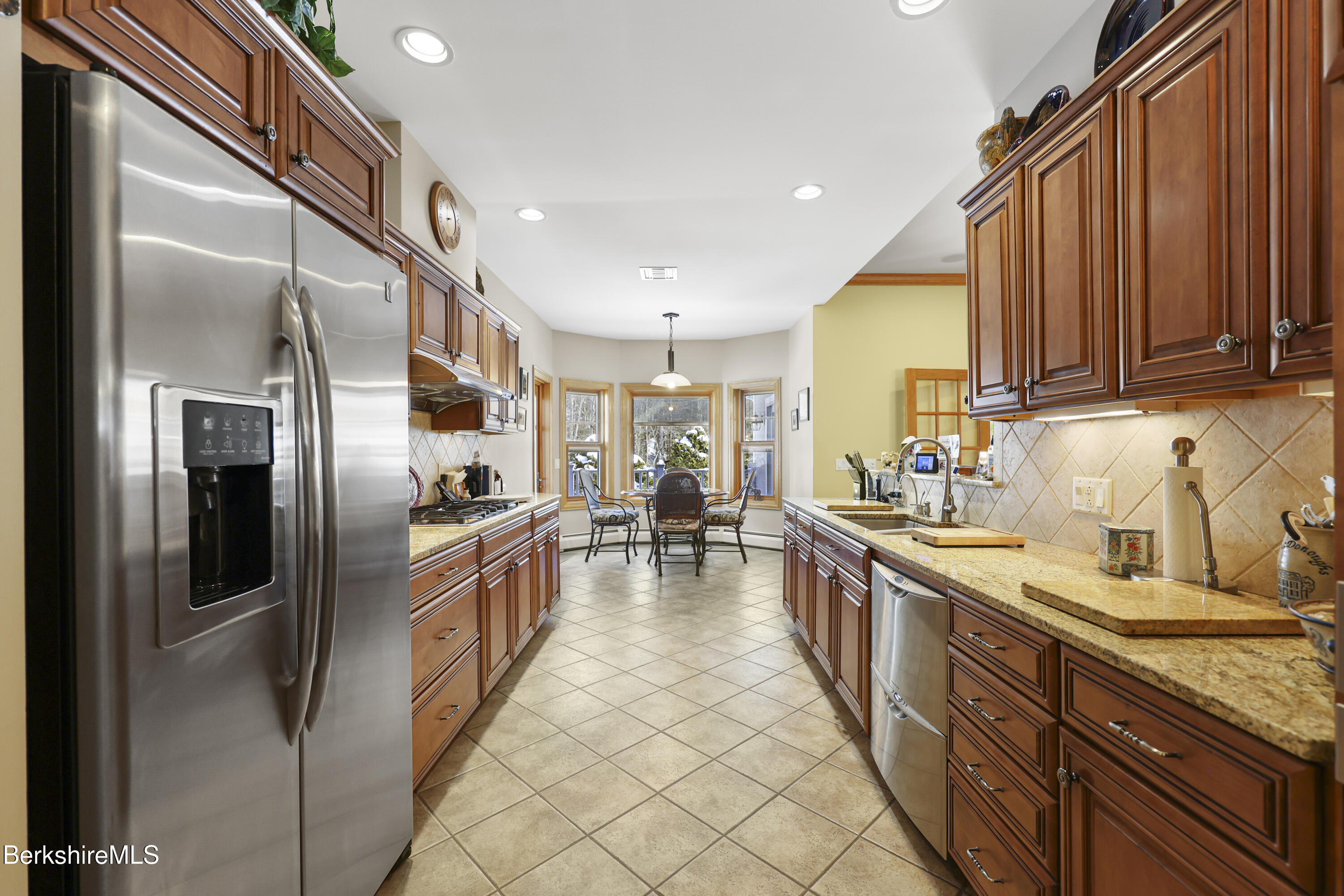 581 Red Barn Road Dalton, MA 01226 - Photo 26 of 65 a large kitchen with stainless steel appliances lots of counter space and a refrigerator