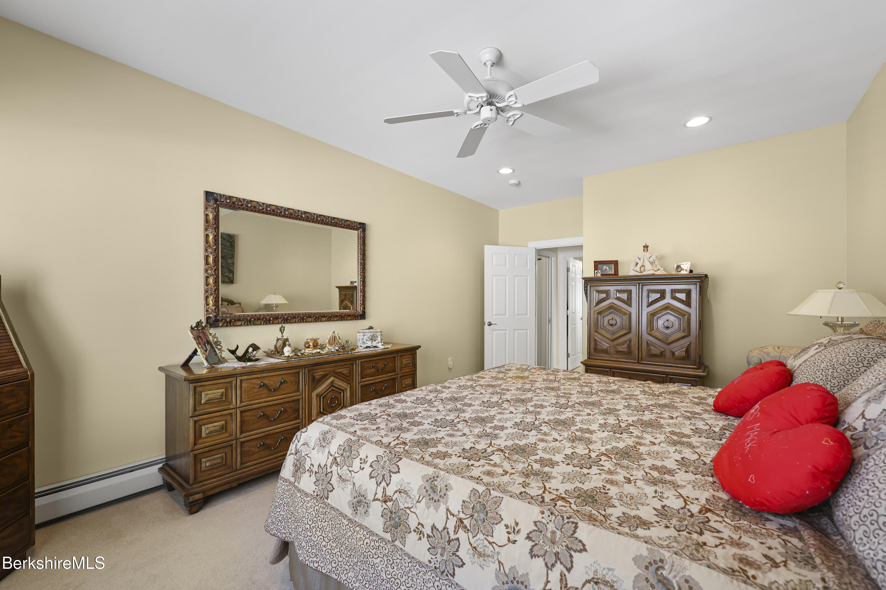 581 Red Barn Road Dalton, MA 01226 - Photo 33 of 65 a bedroom with a bed and dresser with mirror