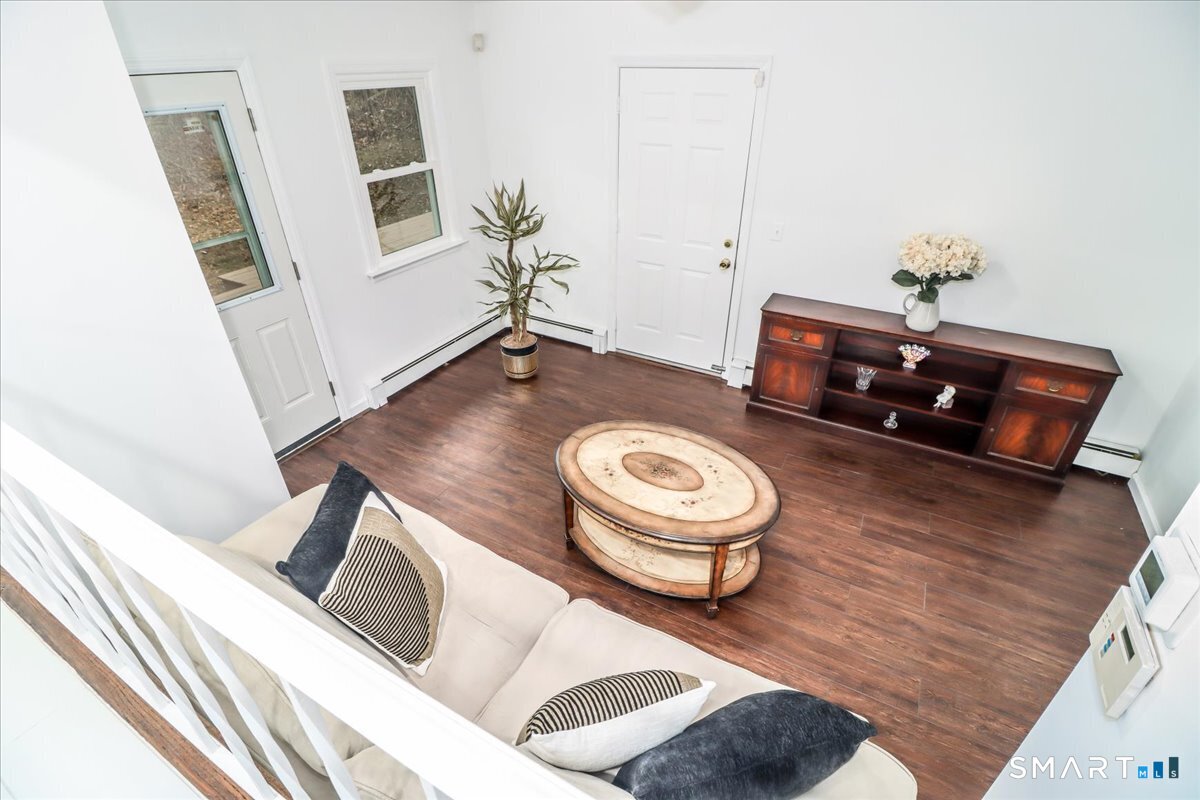 33 Hickory Hill Road Brookfield, CT 06804 - Photo 16 of 35 a living room with furniture and a wooden floor