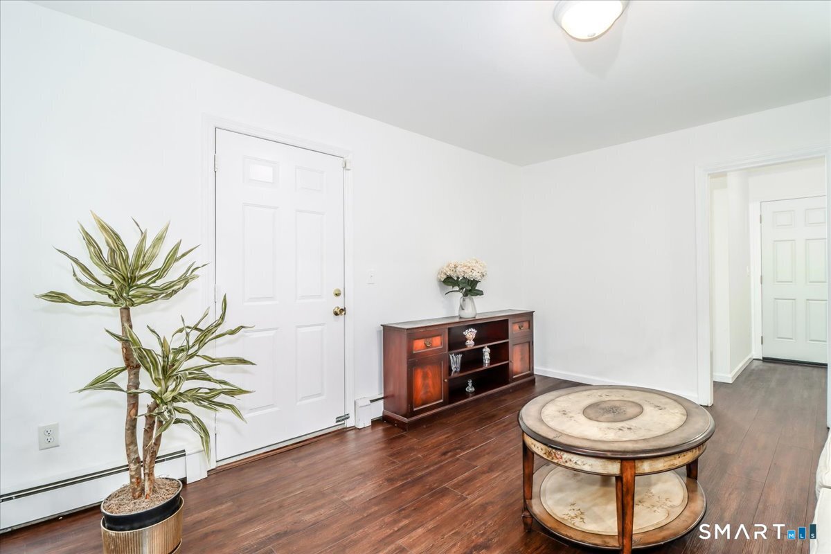 33 Hickory Hill Road Brookfield, CT 06804 - Photo 17 of 35 a living room with furniture and a potted plant