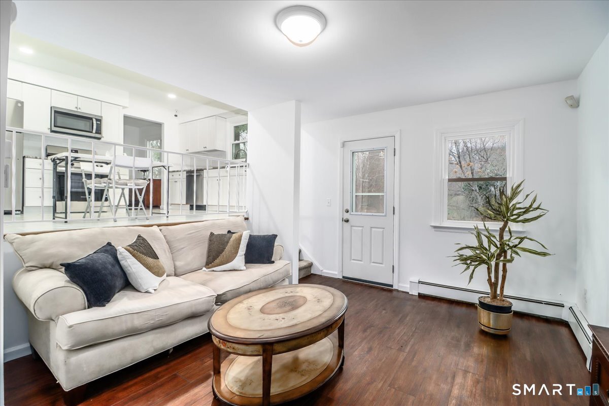 33 Hickory Hill Road Brookfield, CT 06804 - Photo 19 of 35 a living room with patio furniture and a wooden floor