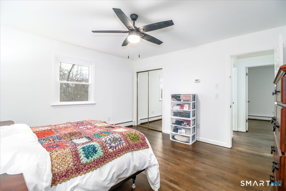 33 Hickory Hill Road Brookfield, CT 06804 - Photo 22 of 35 a bedroom with a bed and a wooden floor