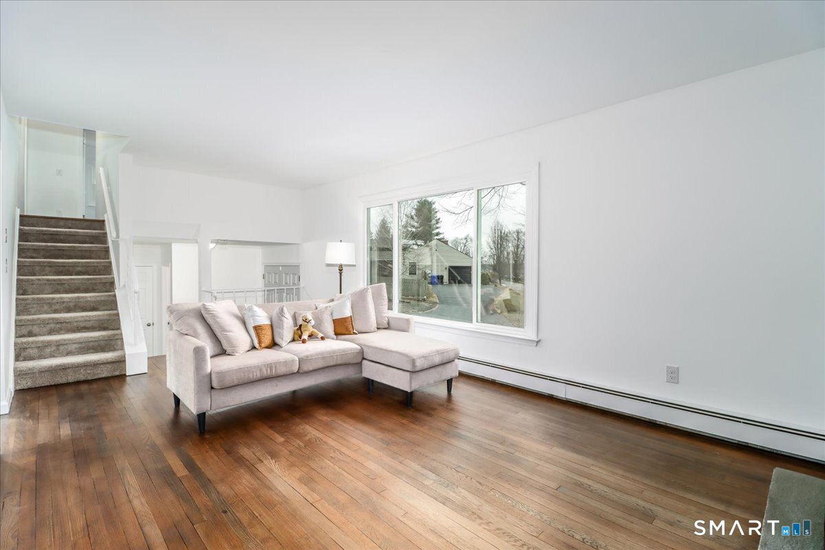 33 Hickory Hill Road Brookfield, CT 06804 - Photo 7 of 35 a living room with furniture and wooden floor