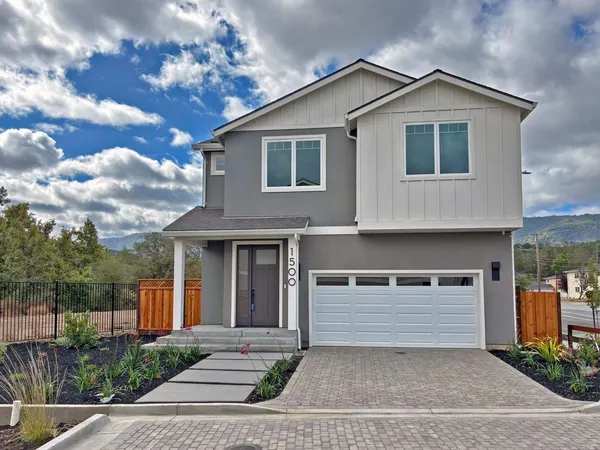 a front view of a house with a garage