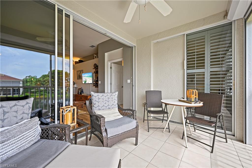 23810 Marbella Bay Road, Unit 203 Estero, FL 34135 - Photo 11 of 47 View of patio with a balcony and ceiling fan