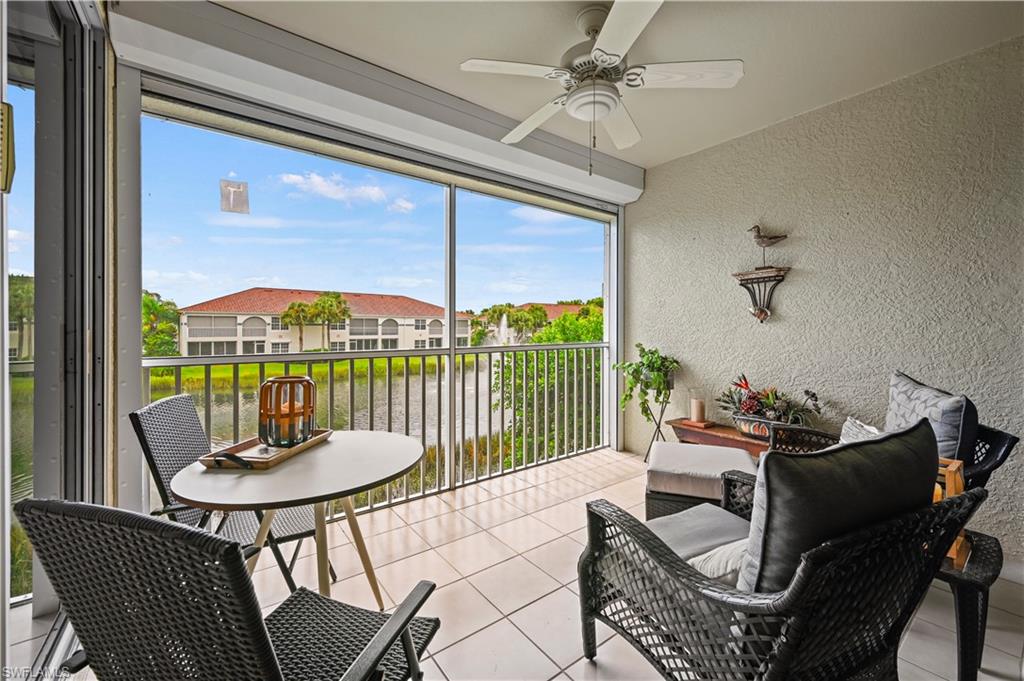 23810 Marbella Bay Road, Unit 203 Estero, FL 34135 - Photo 12 of 47 Sunroom with ceiling fan