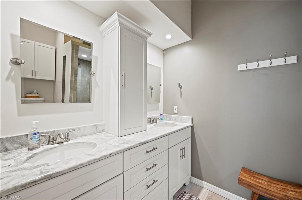 23810 Marbella Bay Road, Unit 203 Estero, FL 34135 - Photo 15 of 47 Bathroom featuring double vanity