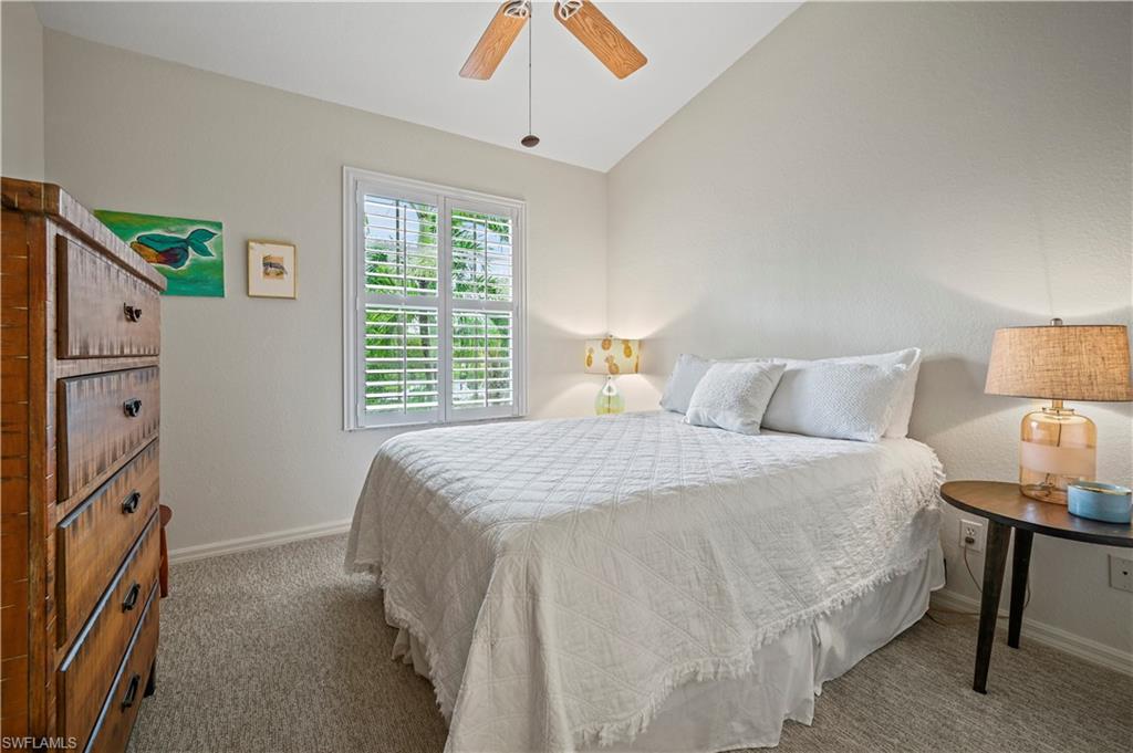 23810 Marbella Bay Road, Unit 203 Estero, FL 34135 - Photo 17 of 47 Carpeted bedroom featuring ceiling fan and lofted ceiling