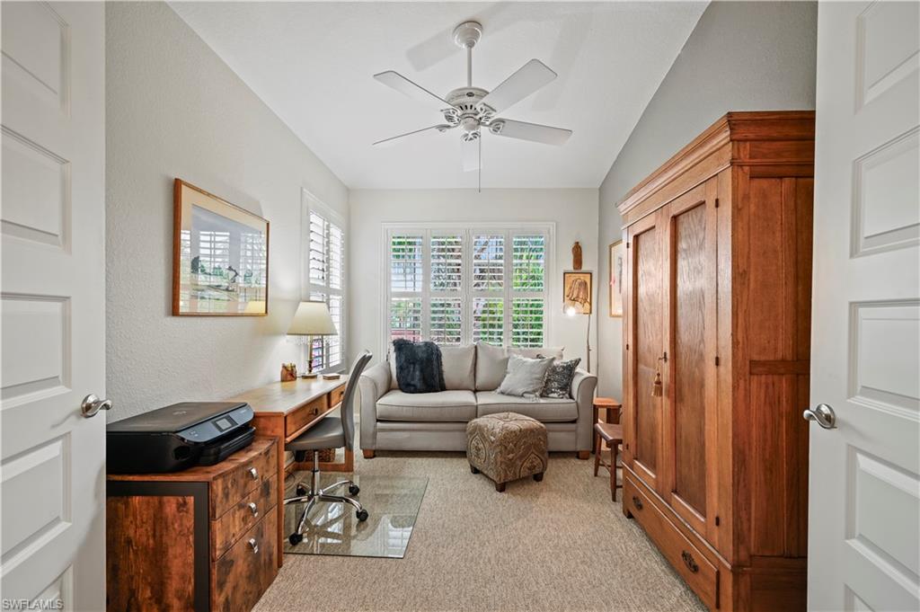 23810 Marbella Bay Road, Unit 203 Estero, FL 34135 - Photo 20 of 47 Carpeted office space featuring ceiling fan and vaulted ceiling