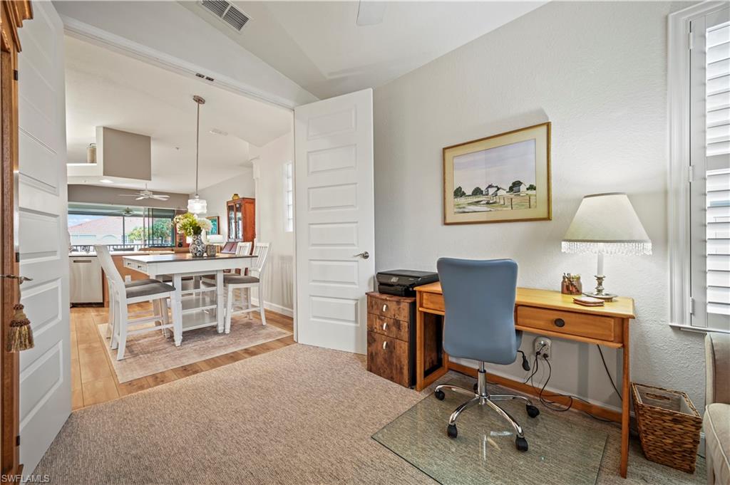 23810 Marbella Bay Road, Unit 203 Estero, FL 34135 - Photo 21 of 47 Office space with ceiling fan, vaulted ceiling, and light hardwood / wood-style floors