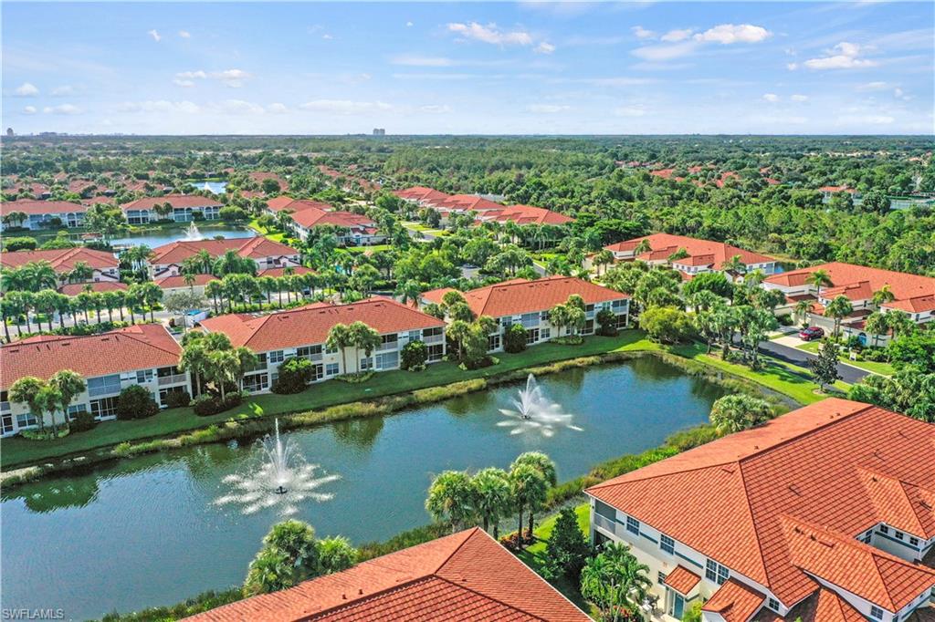 23810 Marbella Bay Road, Unit 203 Estero, FL 34135 - Photo 24 of 47 Aerial view featuring a water view