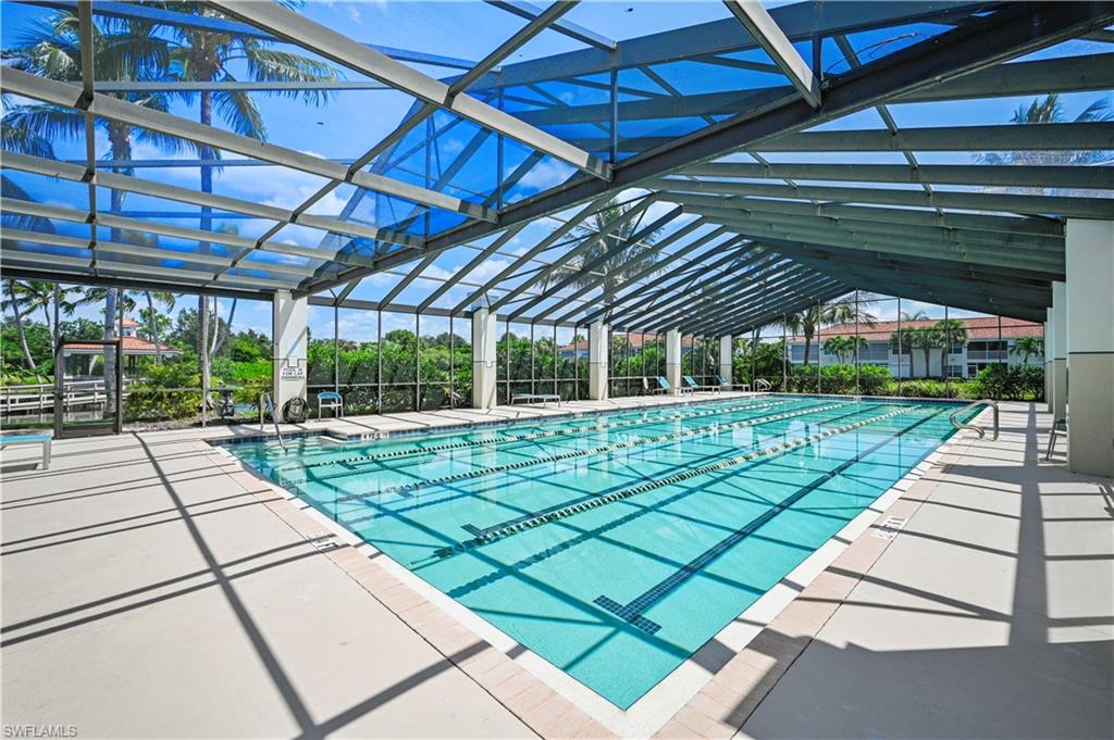 23810 Marbella Bay Road, Unit 203 Estero, FL 34135 - Photo 32 of 47 View of pool with glass enclosure and a patio