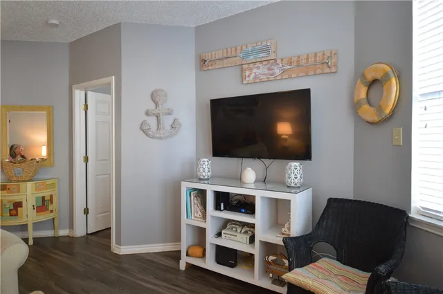 a living room with furniture and a lamp