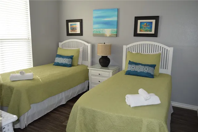 a bedroom with a bed and a fireplace