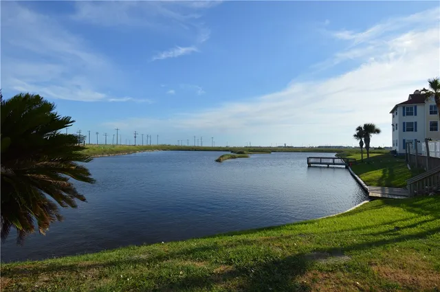 a view of a lake with a yard