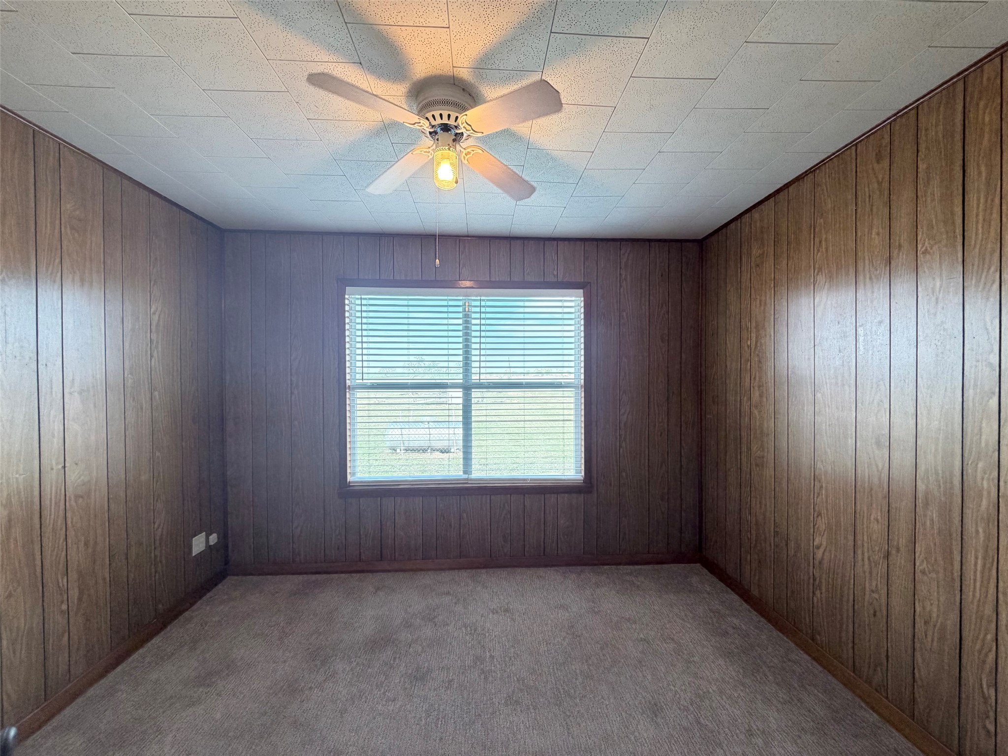 500 Greasy Bend Road Smithville, TX 78957 - Photo 12 of 21 an empty room with a window and a fan
