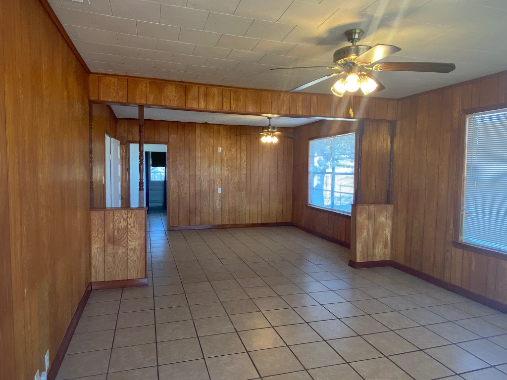 500 Greasy Bend Road Smithville, TX 78957 - Photo 2 of 18 an empty room with chandelier fan and windows