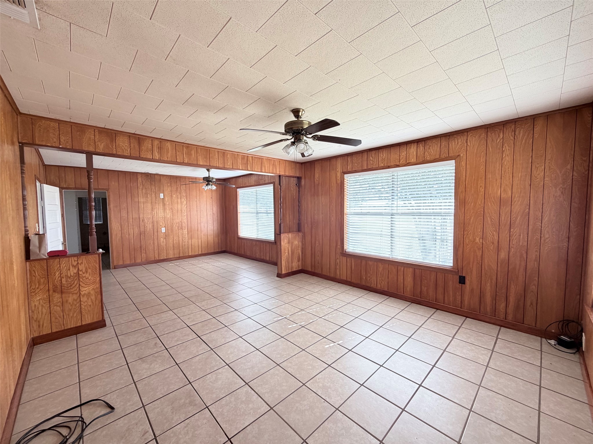 500 Greasy Bend Road Smithville, TX 78957 - Photo 2 of 21 an empty room with windows and cabinet