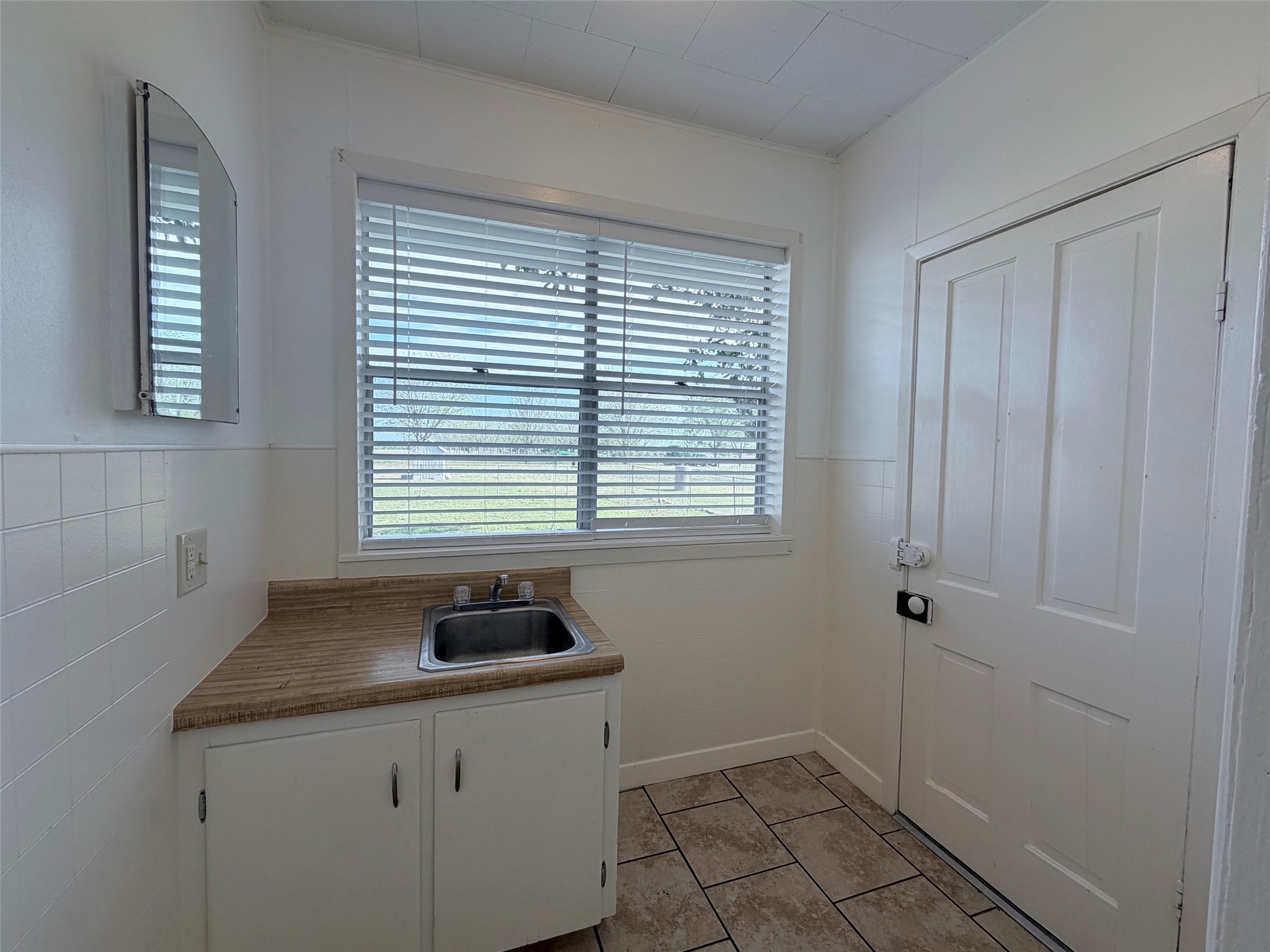 500 Greasy Bend Road Smithville, TX 78957 - Photo 8 of 21 a bathroom with a sink a vanity and a window