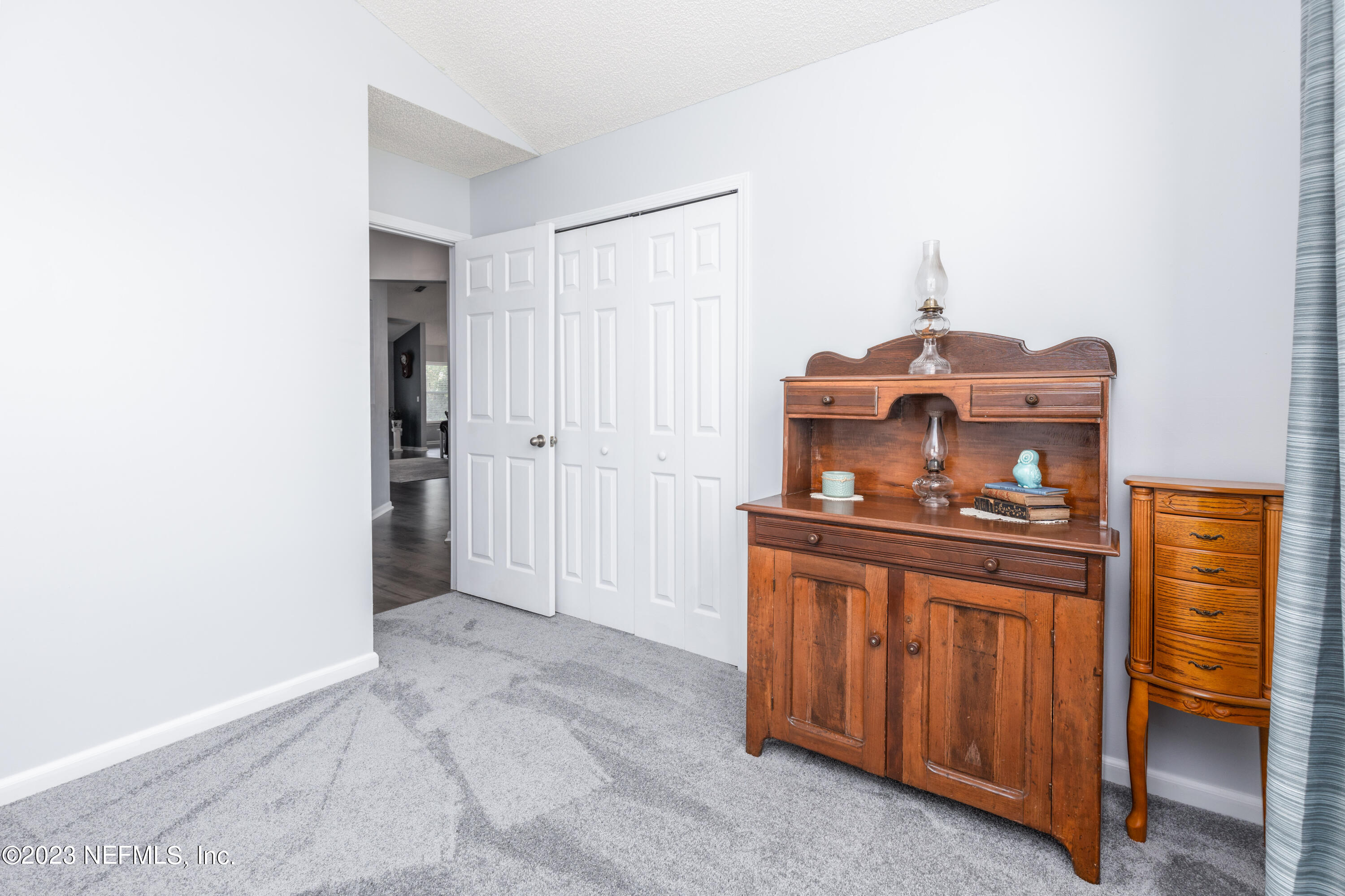 9698 Pritmore Road East Jacksonville, FL 32257 - Photo 16 of 28 a kitchen with a stove and a refrigerator