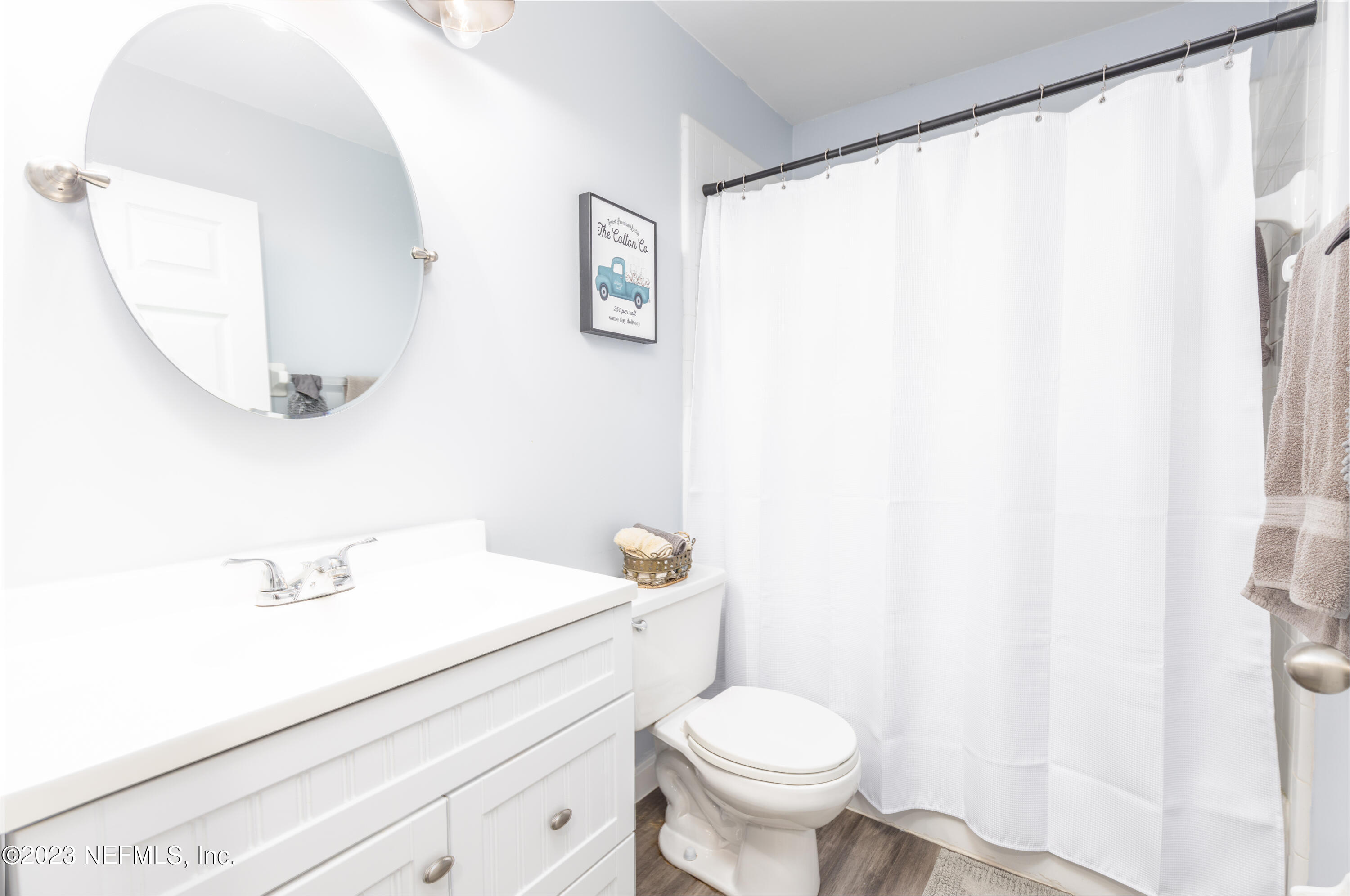 9698 Pritmore Road East Jacksonville, FL 32257 - Photo 17 of 28 a bathroom with a sink a toilet and a mirror