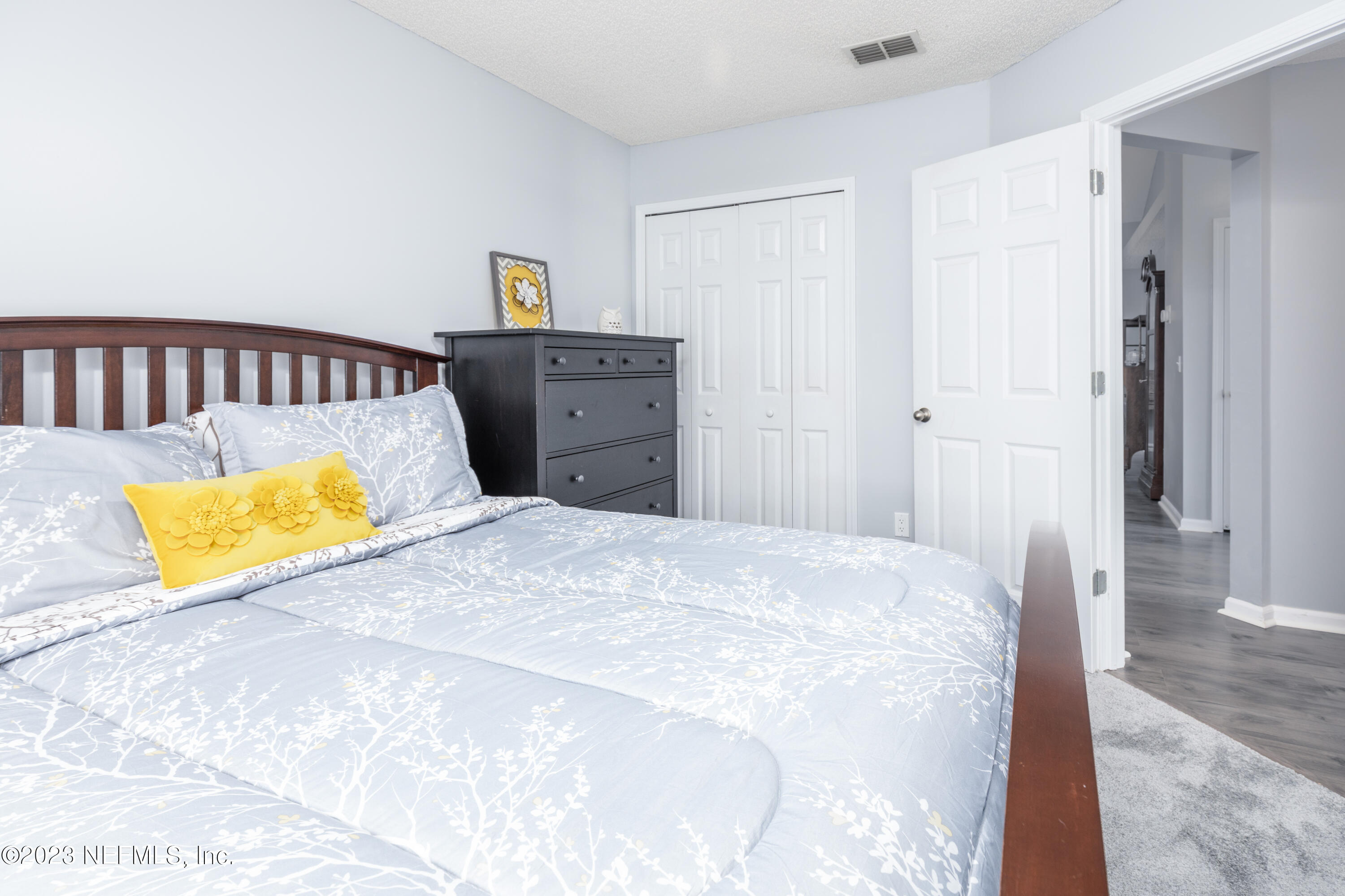 9698 Pritmore Road East Jacksonville, FL 32257 - Photo 19 of 28 a bedroom with a bed and a couch