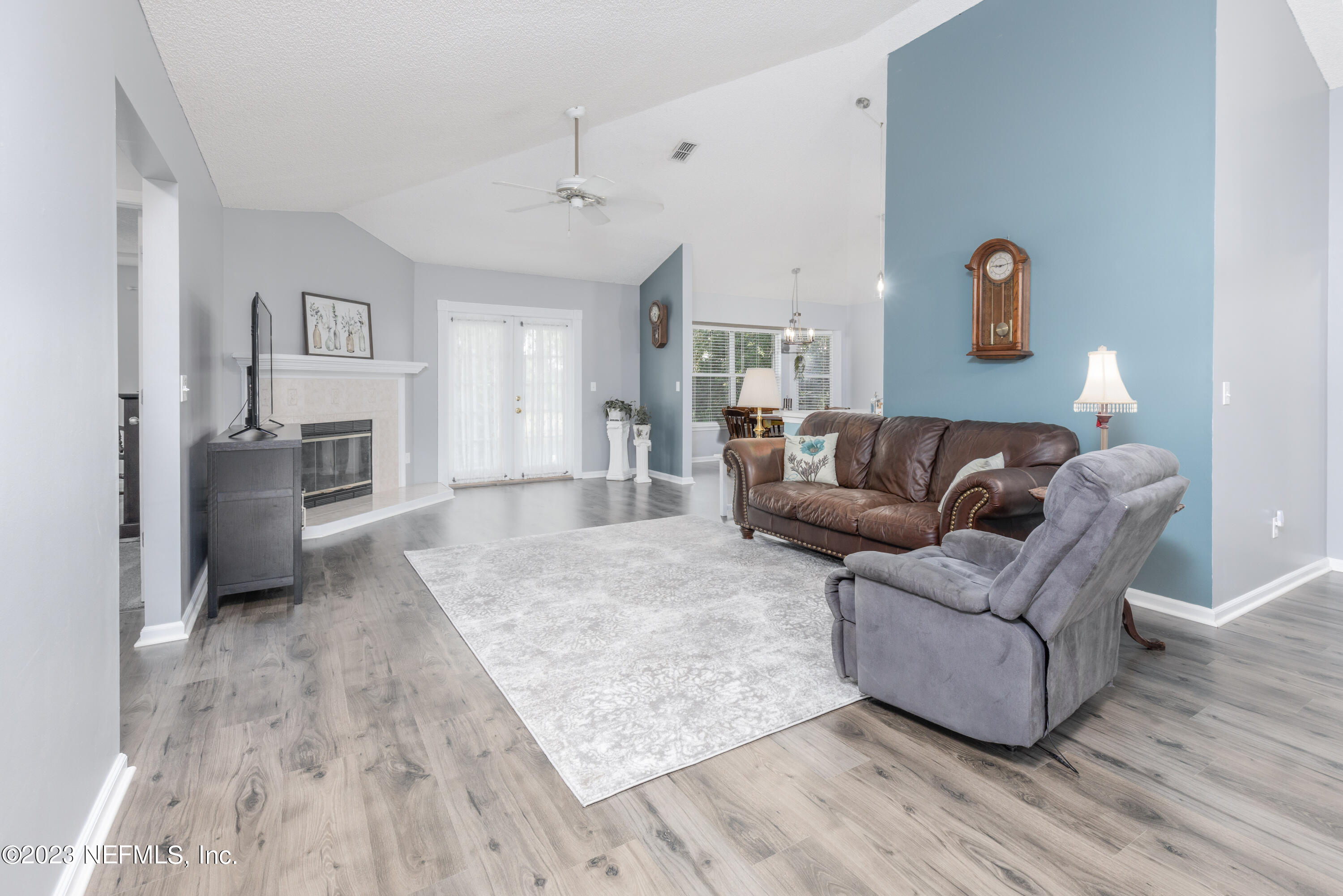 9698 Pritmore Road East Jacksonville, FL 32257 - Photo 28 of 28 a living room with furniture and a wooden floor