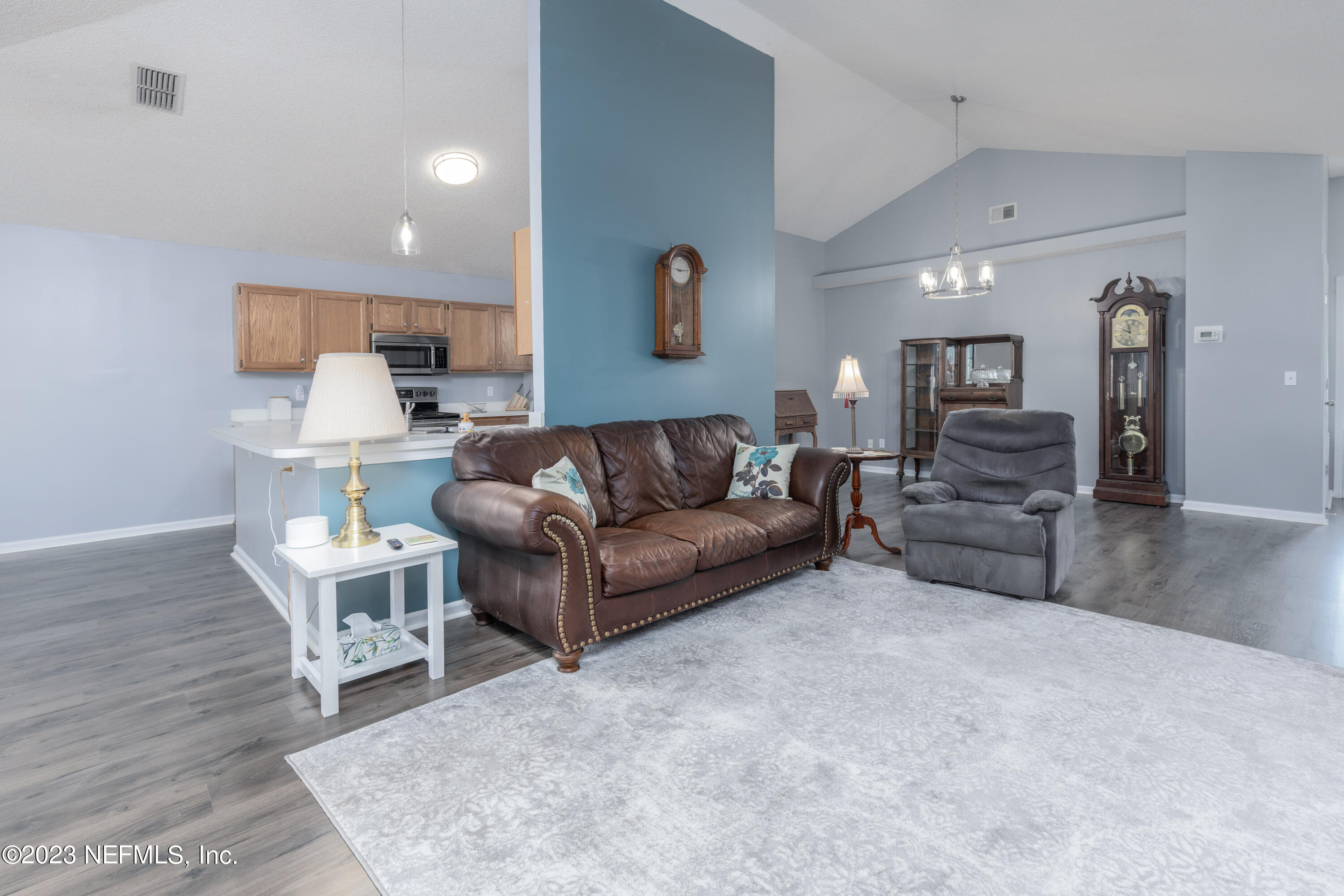 9698 Pritmore Road East Jacksonville, FL 32257 - Photo 5 of 28 a living room with furniture and a wooden floor