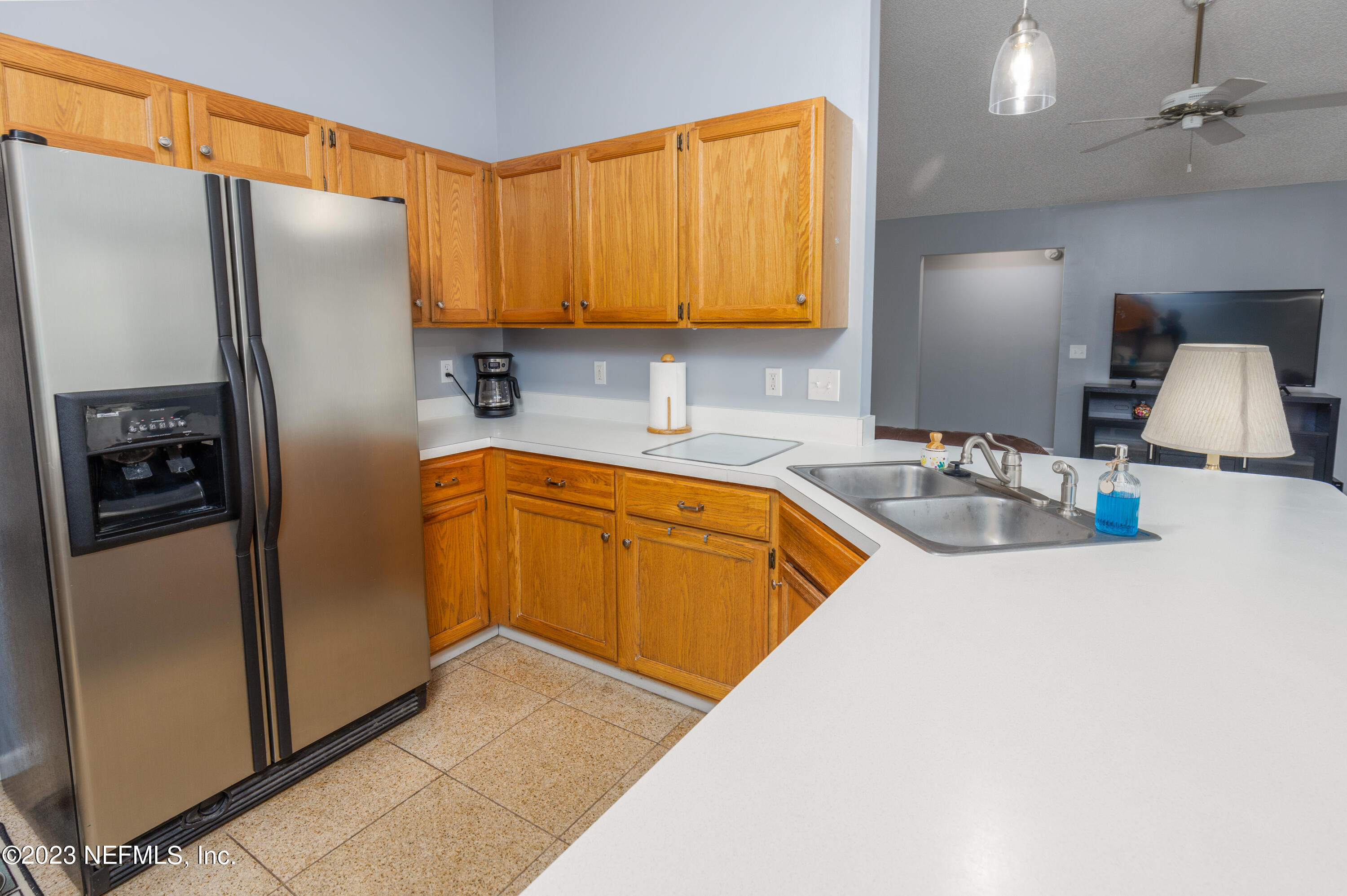 9698 Pritmore Road East Jacksonville, FL 32257 - Photo 8 of 28 a kitchen with stainless steel appliances granite countertop a refrigerator a sink and a stove
